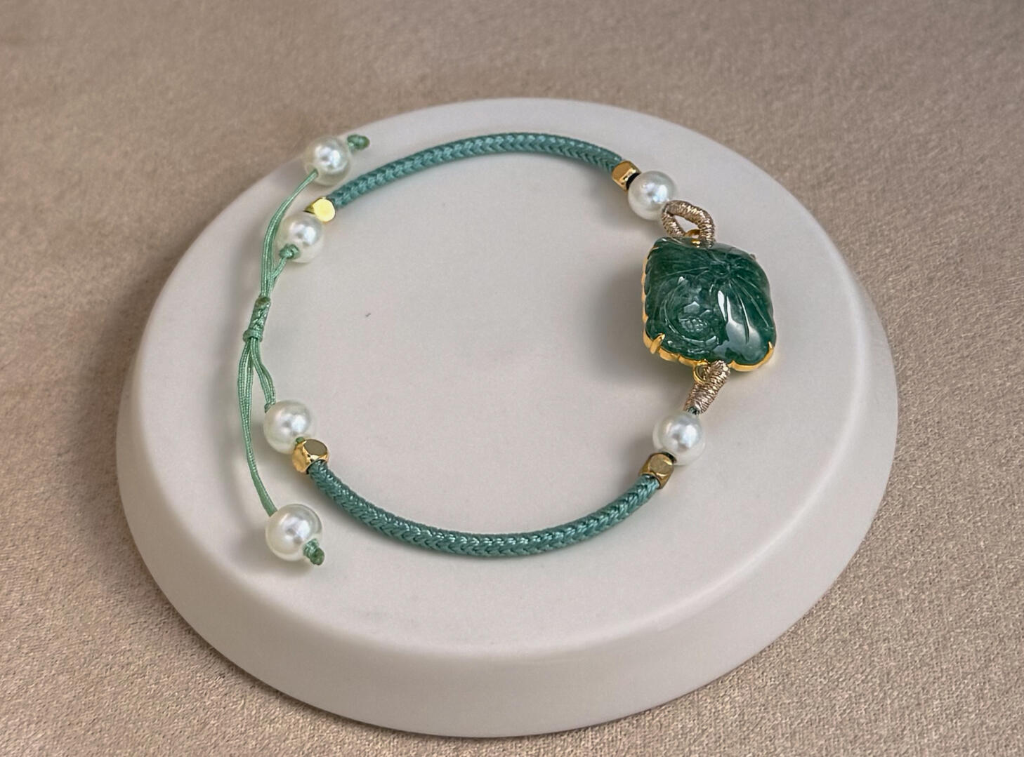 Close up Jadeite Sheer White Leaf with intense green spacer on white disc