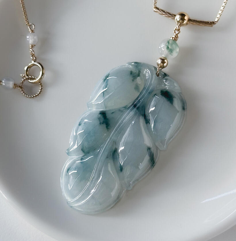 Flora jadeite leaf with translucent flora top bead and gold bead bail on gold chain necklace